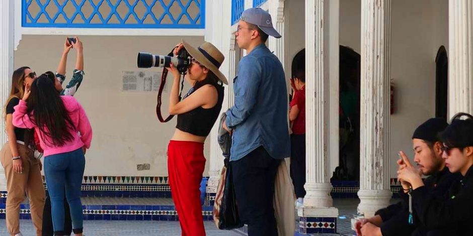 tourists in bahia palace marrakech