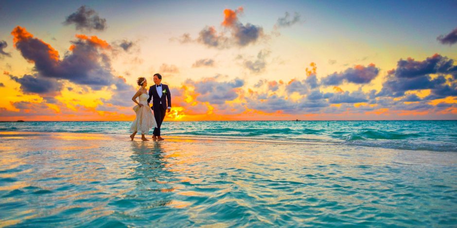 honeymooners walking in the sea