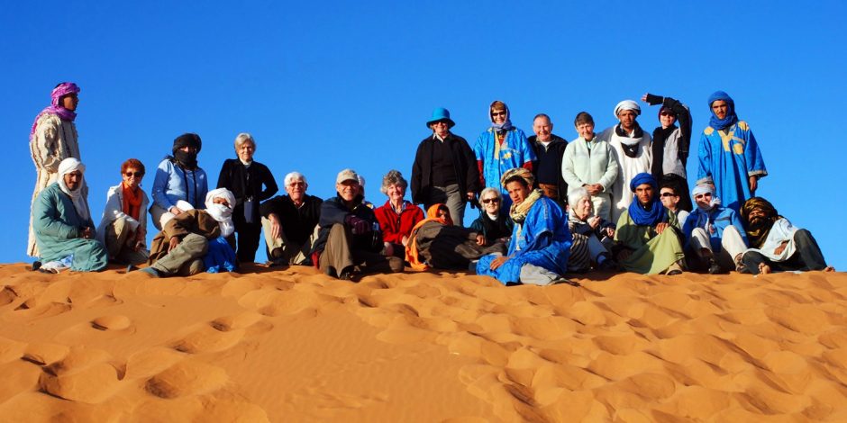 tourists in moroccan sahara desert