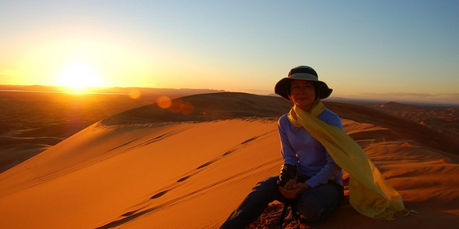woman enjoying desert sunset