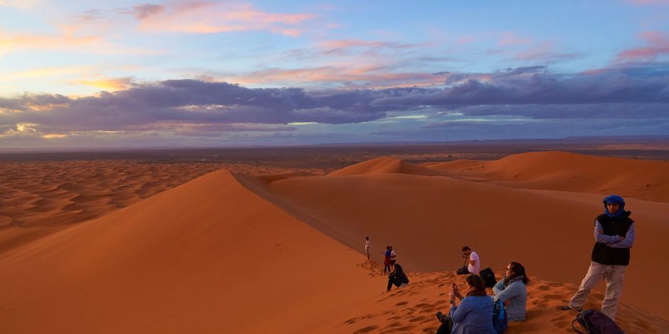 tourists enjoying desert in merzouga