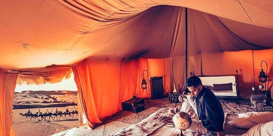 man inside sahara tent