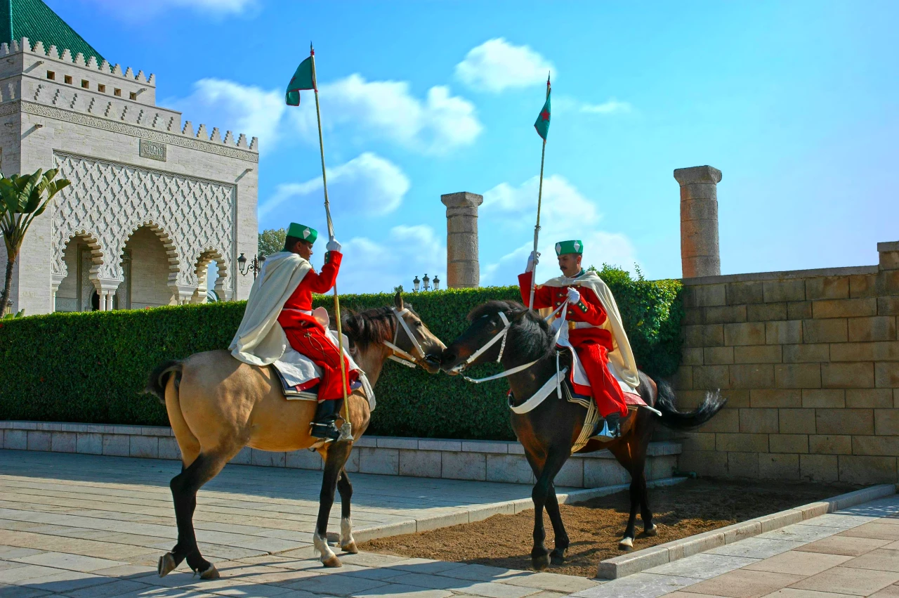 two royal guards with horses near Rabat Mausoleum