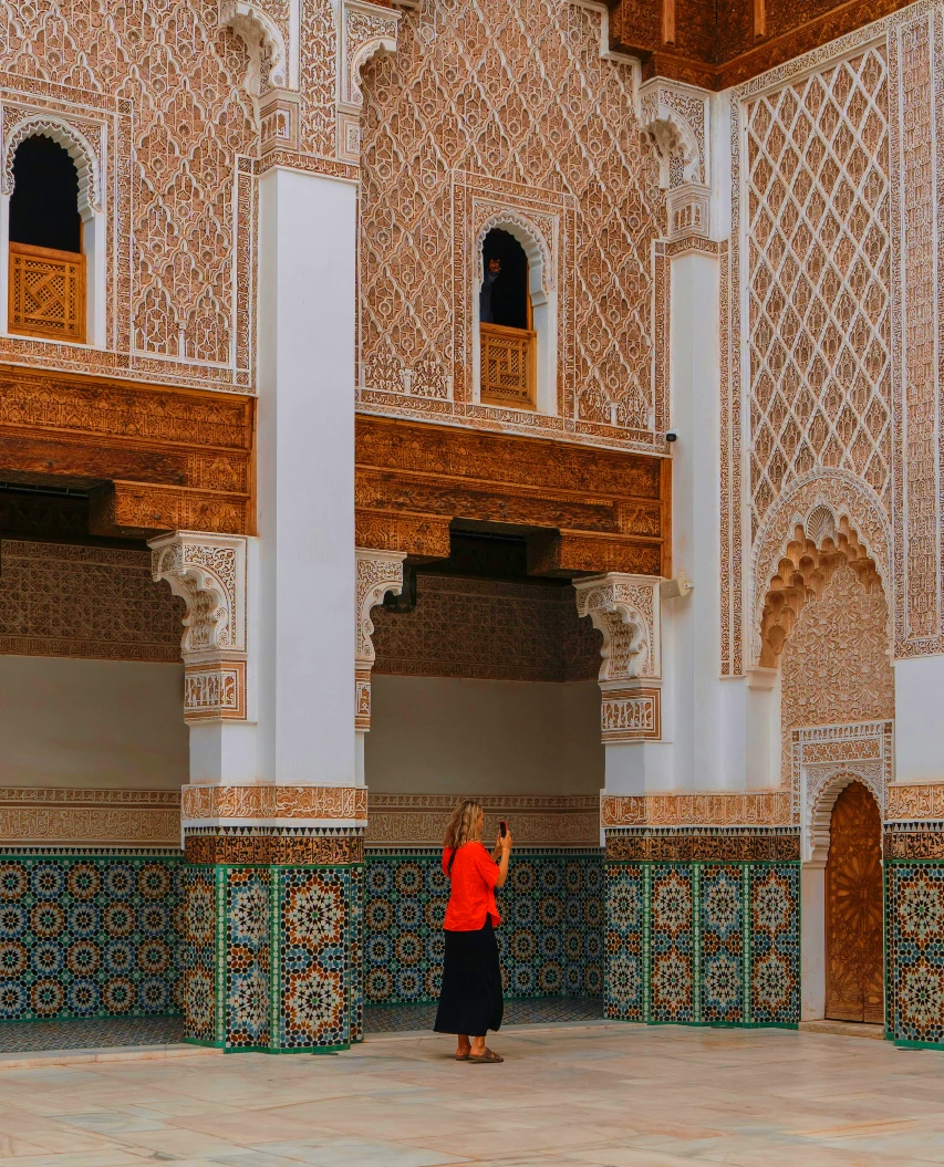 woman tourist taking photo in Marrakech medersa