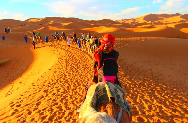 camel ride in moroccan sahara