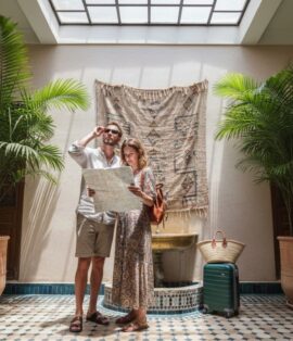Travelers relaxing in Marrakech riad courtyard