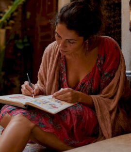 Traveler planning Morocco trip with brochures