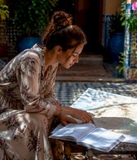 Traveler planning Morocco itinerary at map