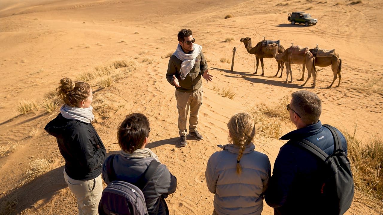 Travel guide explaining Sahara desert tour